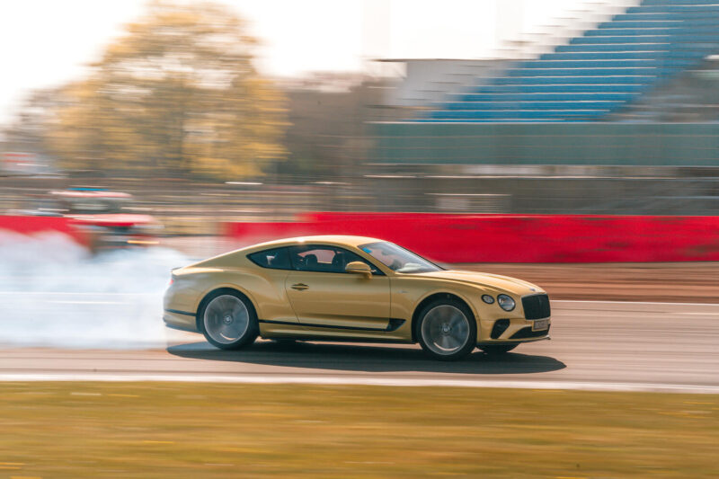 A car drifts around a racetrack.