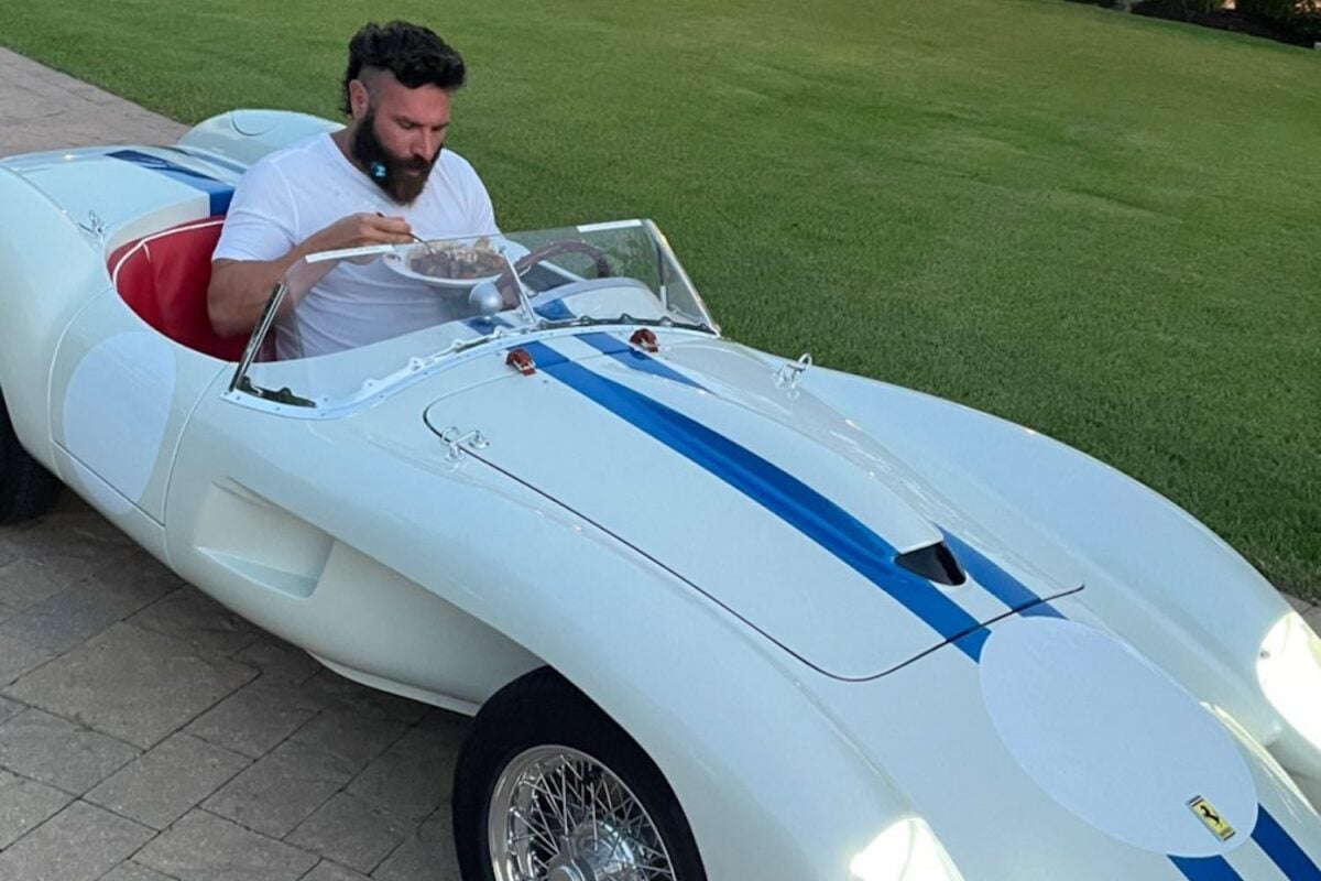 Dan Bilzerian eating in one of his novelty cars