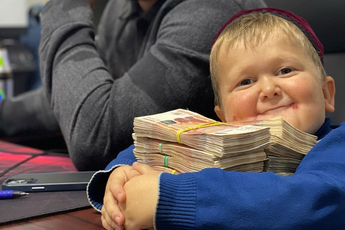 Hasbulla posing with piles of cash. Hasbulla's net worth is thought to be over $100,000.